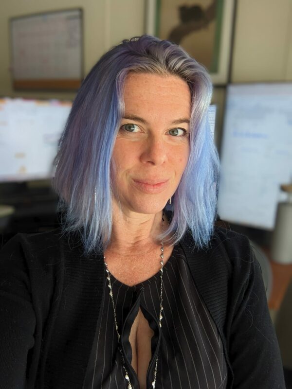 selfie of a person at work with pale blue hair